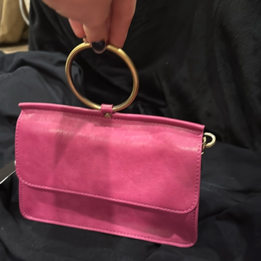 Magenta wristlet purple with strap included inside